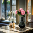 Vijf lichtroze pioenen